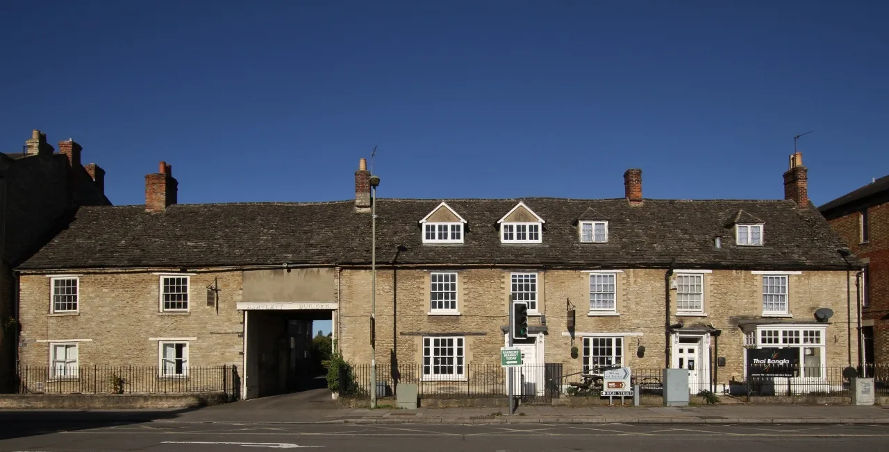 High Street, Witney. West Oxfordshire District Council collects the bins and decides the planning applications across the district, and its abolition is now on hold