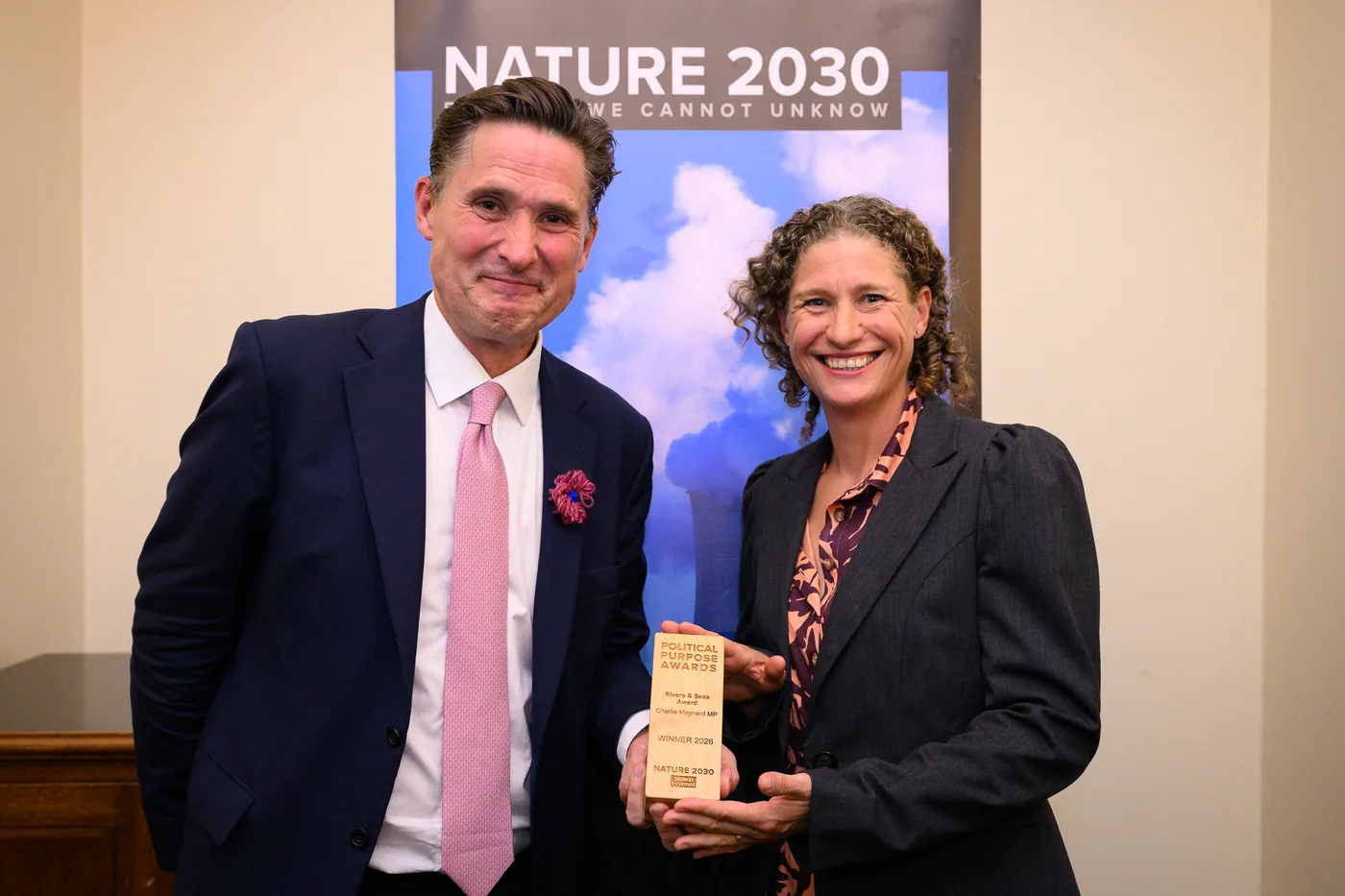 Charlie Maynard with the Rivers and Seas Award trophy, engraved with his name, at the Political Purpose Awards in the House of Commons